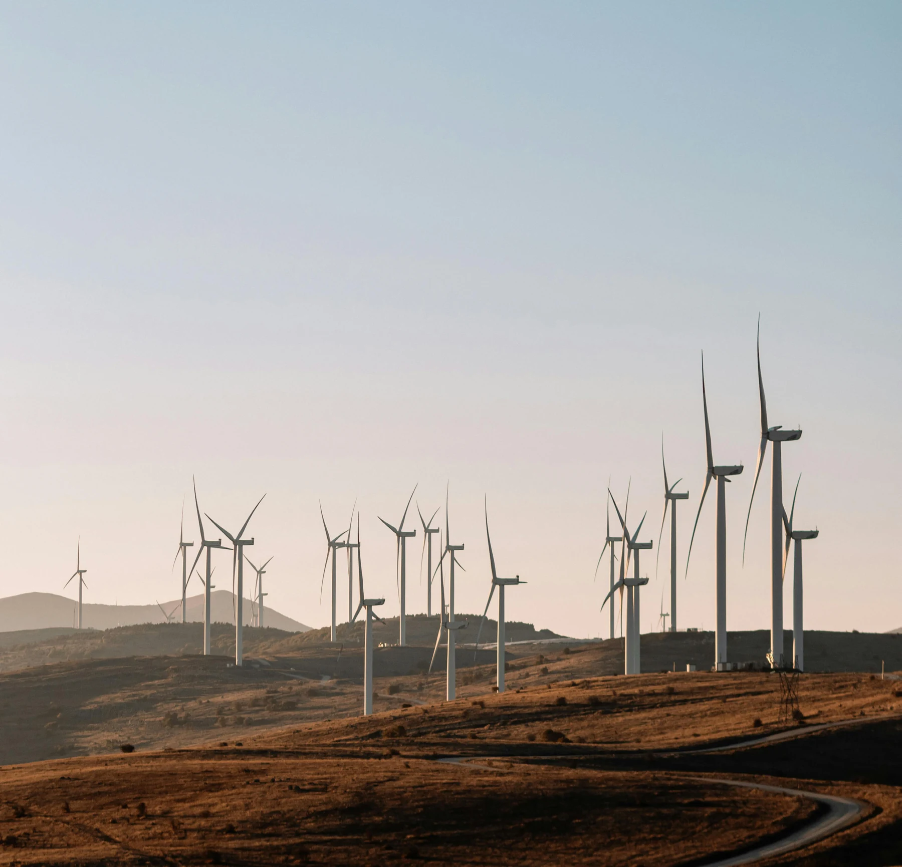 Wind turbines across a mountain landscape